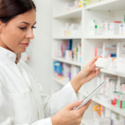 woman pharmacist checking inventory