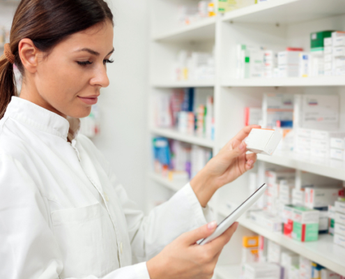 woman pharmacist checking inventory