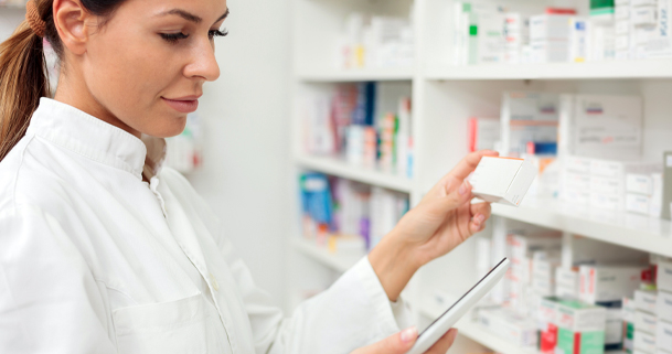 woman pharmacist checking inventory