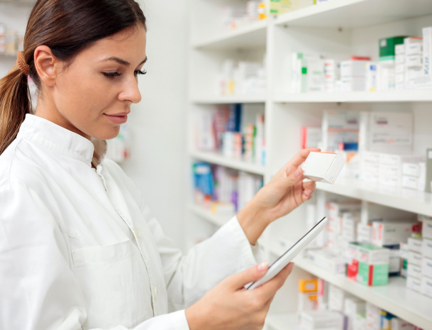 woman pharmacist checking inventory