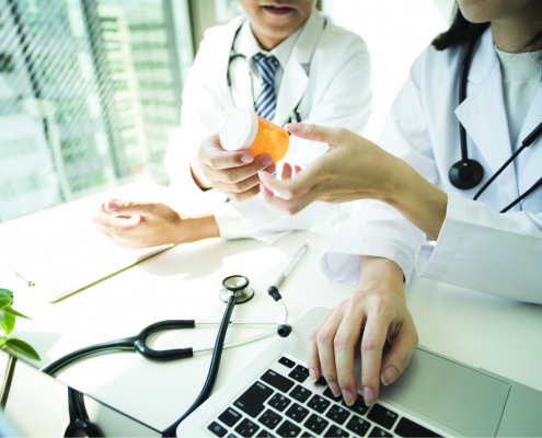 two doctors reviewing medication