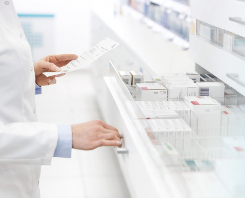Pharmacist checking prescription inventory